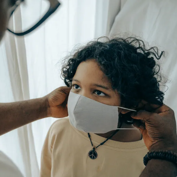 A health worker in a protective mask