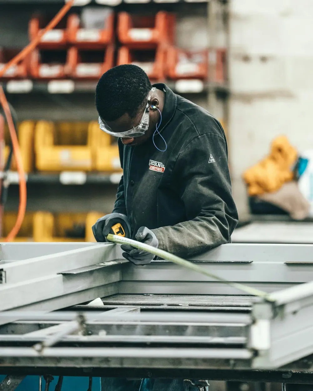 A worker measuring up on site